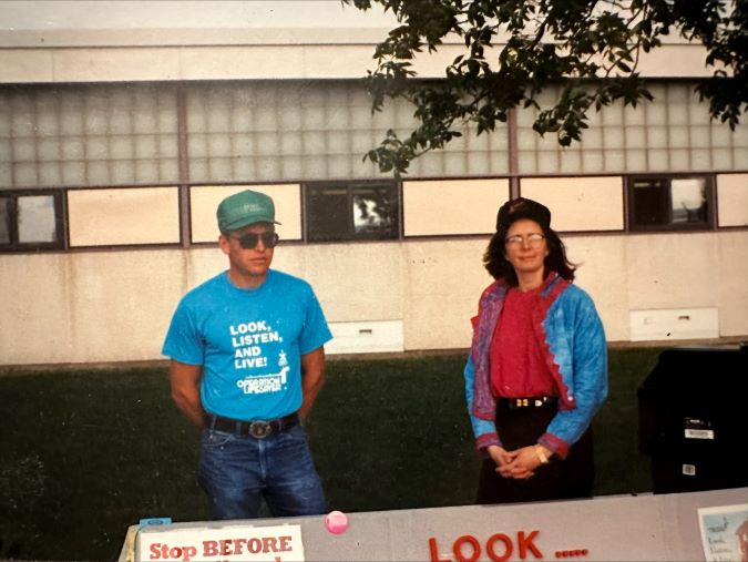 Dale Dannewitz volunteers with Locomotive Engineer Cheri Bonebrake at an Operation Lifesaver event circa 1994. 